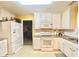 Well-lit kitchen with ample storage, stainless appliances, and stylish granite countertops at 2782 Wynhaven Oaks Way, Lawrenceville, GA 30043