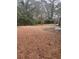 Expansive backyard with mature trees and ample space for outdoor activities and landscaping at 4300 Shady Lane Way, Forest Park, GA 30297