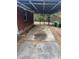 Spacious carport featuring a paved area, metal roof, and fenced-in area, offering covered parking and storage at 4300 Shady Lane Way, Forest Park, GA 30297