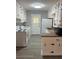 Bright kitchen features white cabinets, laminate countertops, and modern appliances at 4300 Shady Lane Way, Forest Park, GA 30297