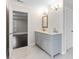 Elegant bathroom featuring double vanity sinks with marble countertops and stylish lighting at 5115 N Pratt St, Covington, GA 30014