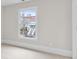 Bright bedroom featuring a window with neighborhood views and neutral walls at 5115 N Pratt St, Covington, GA 30014