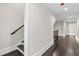 Second floor hallway showcasing natural lighting and hardwood flooring at 5115 N Pratt St, Covington, GA 30014