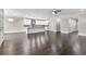 Bright and airy living area showcasing hardwood floors, white trim, and an open floor plan connecting the kitchen at 5115 N Pratt St, Covington, GA 30014
