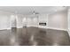 Spacious living room featuring hardwood floors, a modern fireplace, recessed lighting, and ample natural light at 5115 N Pratt St, Covington, GA 30014