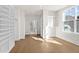 Walk-in closet with built-in shelving units and hardwood flooring at 2711 Twisted Oak Ne Ln, Marietta, GA 30066