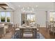 Dining room with modern chandelier, table with seating, and access to the outdoors at 2711 Twisted Oak Ne Ln, Marietta, GA 30066