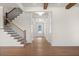 Open entryway featuring hardwood floors, staircase, and coffered ceilings at 2711 Twisted Oak Ne Ln, Marietta, GA 30066