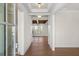 Bright foyer featuring wood floors, neutral walls, and an open view into a room with wooden ceiling beams at 2711 Twisted Oak Ne Ln, Marietta, GA 30066