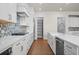 Modern kitchen featuring white countertops, stainless steel appliances, and a pantry at 2711 Twisted Oak Ne Ln, Marietta, GA 30066