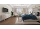 Main bedroom features a tray ceiling, hardwood floors, and sitting area at 2711 Twisted Oak Ne Ln, Marietta, GA 30066