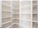 Spacious walk-in pantry with white shelving and ample storage space at 2711 Twisted Oak Ne Ln, Marietta, GA 30066