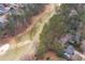 Scenic aerial shot of a lush golf course surrounded by mature trees and beautiful homes at 5485 Brookstone Nw Dr, Acworth, GA 30101