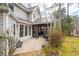 Backyard featuring a sunroom addition to the house and a stone patio at 5485 Brookstone Nw Dr, Acworth, GA 30101