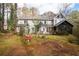 A spacious backyard and a screened-in porch enhance outdoor living and enjoyment at 5485 Brookstone Nw Dr, Acworth, GA 30101