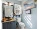 Charming bathroom features granite vanity, framed mirror, and a toilet with humorous decor at 5485 Brookstone Nw Dr, Acworth, GA 30101