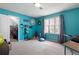 Inviting bedroom featuring blue walls, large window, and a walk-in closet at 5485 Brookstone Nw Dr, Acworth, GA 30101