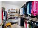 Walk-in closet features built-in shelving for ample storage of clothing, shoes, and accessories at 5485 Brookstone Nw Dr, Acworth, GA 30101
