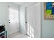 Bright entryway features tile flooring, an exterior door with sheer curtain, and an interior door at 5485 Brookstone Nw Dr, Acworth, GA 30101