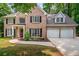 Gorgeous brick home with a manicured lawn and a two-car garage at 5485 Brookstone Nw Dr, Acworth, GA 30101