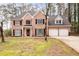 Charming brick home with a manicured lawn, black shutters and attached two-car garage at 5485 Brookstone Nw Dr, Acworth, GA 30101
