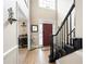 Elegant foyer featuring hardwood floors, high ceilings and an adjacent staircase at 5485 Brookstone Nw Dr, Acworth, GA 30101