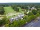 Aerial image capturing the lush golf course with mature trees at 5485 Brookstone Nw Dr, Acworth, GA 30101