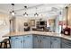 Kitchen island with granite countertop overlooking the dining area and fireplace at 5485 Brookstone Nw Dr, Acworth, GA 30101