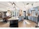Bright kitchen with blue cabinets, island and hardwood floors at 5485 Brookstone Nw Dr, Acworth, GA 30101