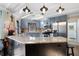 Bright kitchen area with a skylight, granite countertops, and stainless steel appliances at 5485 Brookstone Nw Dr, Acworth, GA 30101