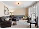 Cozy living room featuring comfortable seating, large windows, and stylish decor at 5485 Brookstone Nw Dr, Acworth, GA 30101