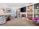 Cozy living room with fireplace, built-in shelving, and comfortable seating at 5485 Brookstone Nw Dr, Acworth, GA 30101