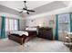Comfortable main bedroom with tray ceiling, two windows, desk, and plush carpet at 5485 Brookstone Nw Dr, Acworth, GA 30101
