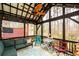 Relaxing screened-in porch with comfortable seating and views of the surrounding nature at 5485 Brookstone Nw Dr, Acworth, GA 30101