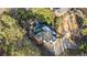 Stunning aerial view of home with wooded lot and private driveway at 11260 Houze Rd, Roswell, GA 30076
