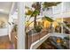 A unique interior atrium with flourishing tropical plants, balconies, and a pond at ground level at 11260 Houze Rd, Roswell, GA 30076