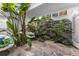 Bright atrium filled with tropical plants, flagstone floor and comfortable seating at 11260 Houze Rd, Roswell, GA 30076