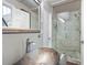 Updated bathroom features a vessel sink and glass enclosed shower with sleek hardware at 11260 Houze Rd, Roswell, GA 30076