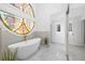 Stunning bathroom with a standalone tub, decorative stained glass, and marble flooring for a spa-like experience at 11260 Houze Rd, Roswell, GA 30076