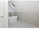 Modern bathroom with white walls, a skylight and a soaking tub at 11260 Houze Rd, Roswell, GA 30076