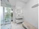 Modern bathroom features bright vanity, glass enclosed shower, and stylish bench at 11260 Houze Rd, Roswell, GA 30076