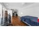 Spacious bedroom with hardwood floors, modern furniture, and a relaxing atmosphere at 11260 Houze Rd, Roswell, GA 30076