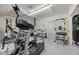 Well-equipped home gym with treadmill, weights, and punching bag for fitness enthusiasts at 11260 Houze Rd, Roswell, GA 30076