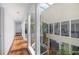 Second floor hallway with views of the interior atrium and skylights above at 11260 Houze Rd, Roswell, GA 30076