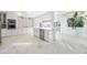 Modern kitchen featuring marble floors, stainless steel appliances, and a breakfast bar at 11260 Houze Rd, Roswell, GA 30076