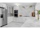 Modern kitchen showcasing stainless steel appliances, marble countertops, and updated cabinetry at 11260 Houze Rd, Roswell, GA 30076