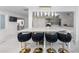 Stylish kitchen featuring bar stools, a marble island, and updated appliances at 11260 Houze Rd, Roswell, GA 30076