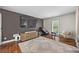 Inviting living room with a wall-mounted television, plush seating, and an elegant rug at 11260 Houze Rd, Roswell, GA 30076