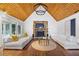 Bright living room featuring vaulted wood ceilings, a stone fireplace, and glass doors to the yard at 11260 Houze Rd, Roswell, GA 30076