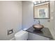 Contemporary half-bathroom with vessel sink, sleek fixtures, and modern toilet at 11260 Houze Rd, Roswell, GA 30076